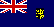 Британский синий кормовой флаг с эмблемой территории в вольной части (англ.: ''The British (Defaced) Blue Ensign with the Badge'')